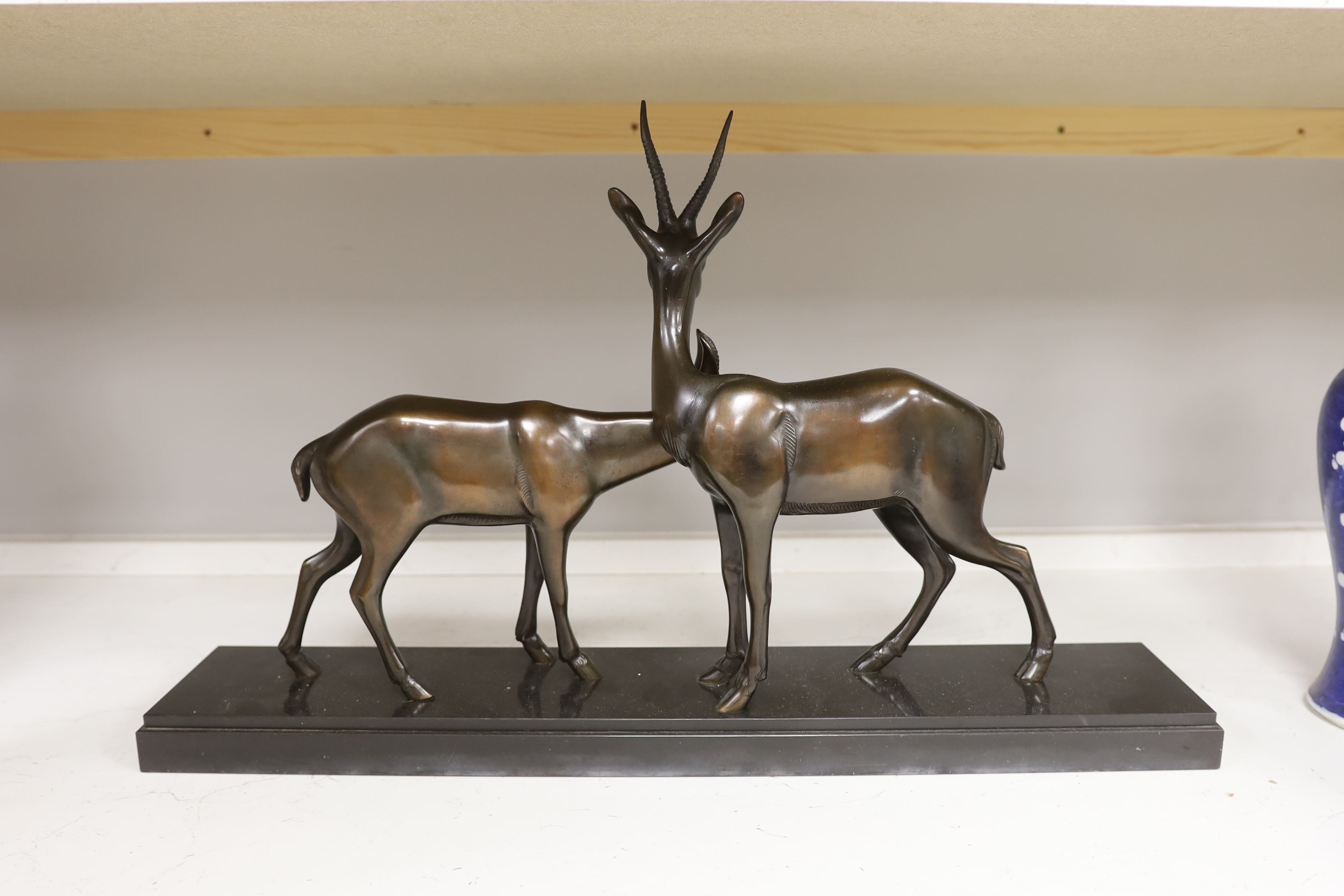 An Art Deco bronzed spelter ‘gazelle’ figure group, 70cm